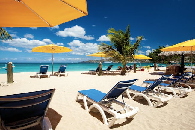 Mount Cinnamon Grenada beach sun loungers and umbrellas on the sand