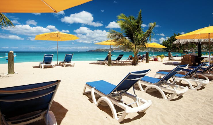 Mount Cinnamon Grenada beach sun loungers and umbrellas on the sand