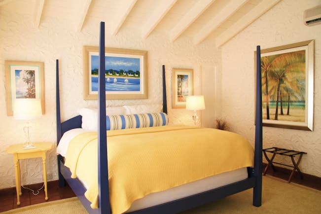 Mount Cinnamon Grenada bedroom double bed paintings on the wall