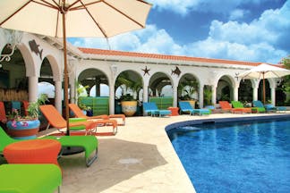 Mount Cinnamon Grenada pool sun loungers and umbrellas 