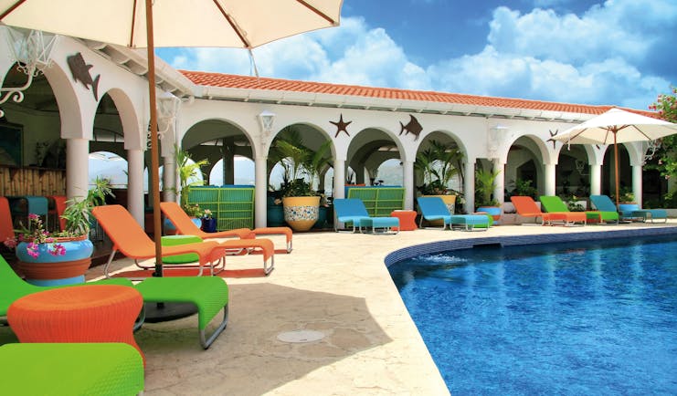 Mount Cinnamon Grenada pool sun loungers and umbrellas 