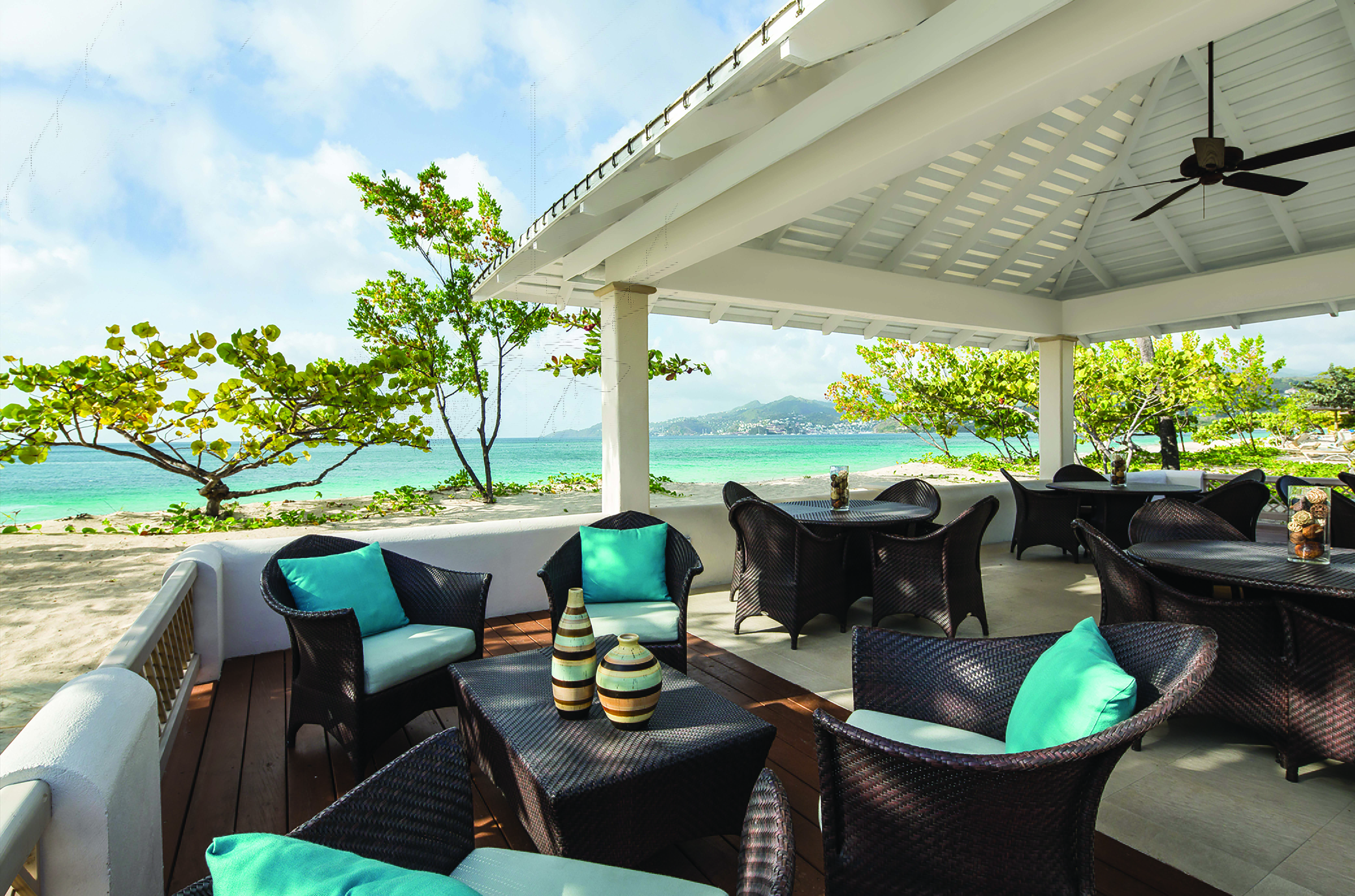 Spice Island Grenada outdoor seating beach terrace tables and chairs overlooking the ocean