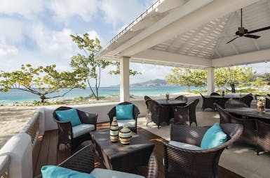 Spice Island Grenada outdoor seating beach terrace tables and chairs overlooking the ocean
