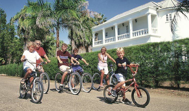 Half Moon Jamaica family cycling activity pavement hedge trees