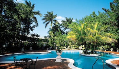 Half Moon Jamaica pool trees surrounding pool terrace sitting area