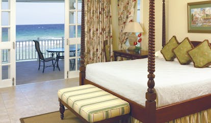 Half Moon Jamaica suite bedroom four poster bed private balcony overlooking sea