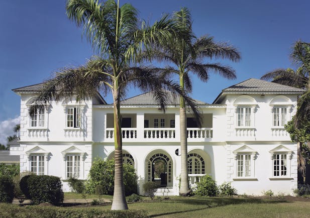 Half Moon Jamaica villa exterior building lawns palm trees