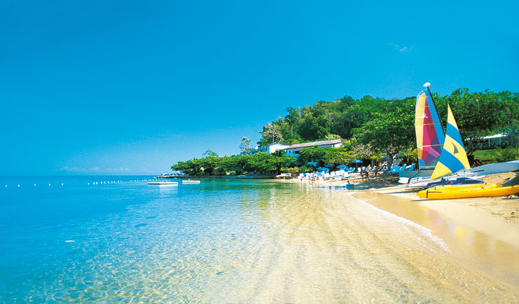 Round Hill Jamaica boats on the beach sandy beach clear blue ocean