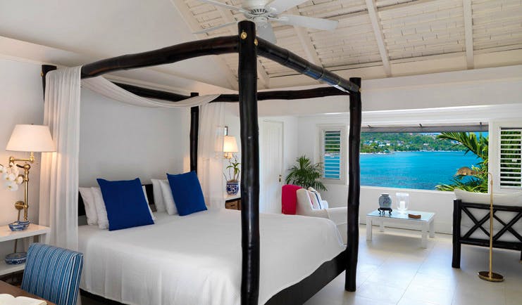 Round Hill Jamaica oceanfront bedroom four poster bed window opening out to ocean views