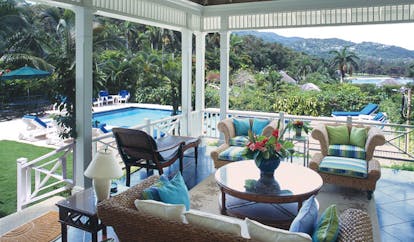 Round Hill Jamaica pineapple suite terrace large seating area pool in background