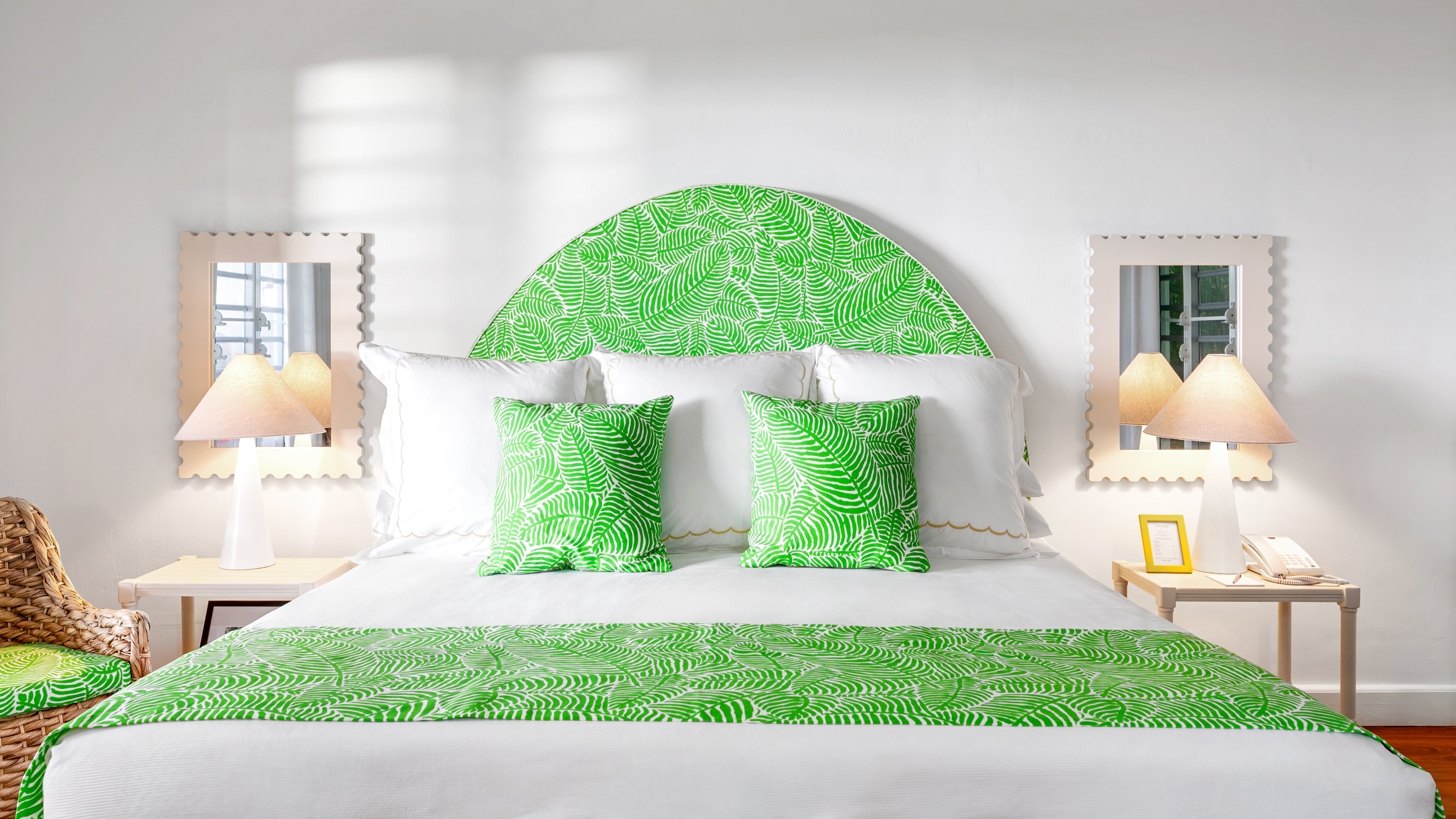 Montpelier Nevis Signature Room with white decor and bright bursts of green on the double bed