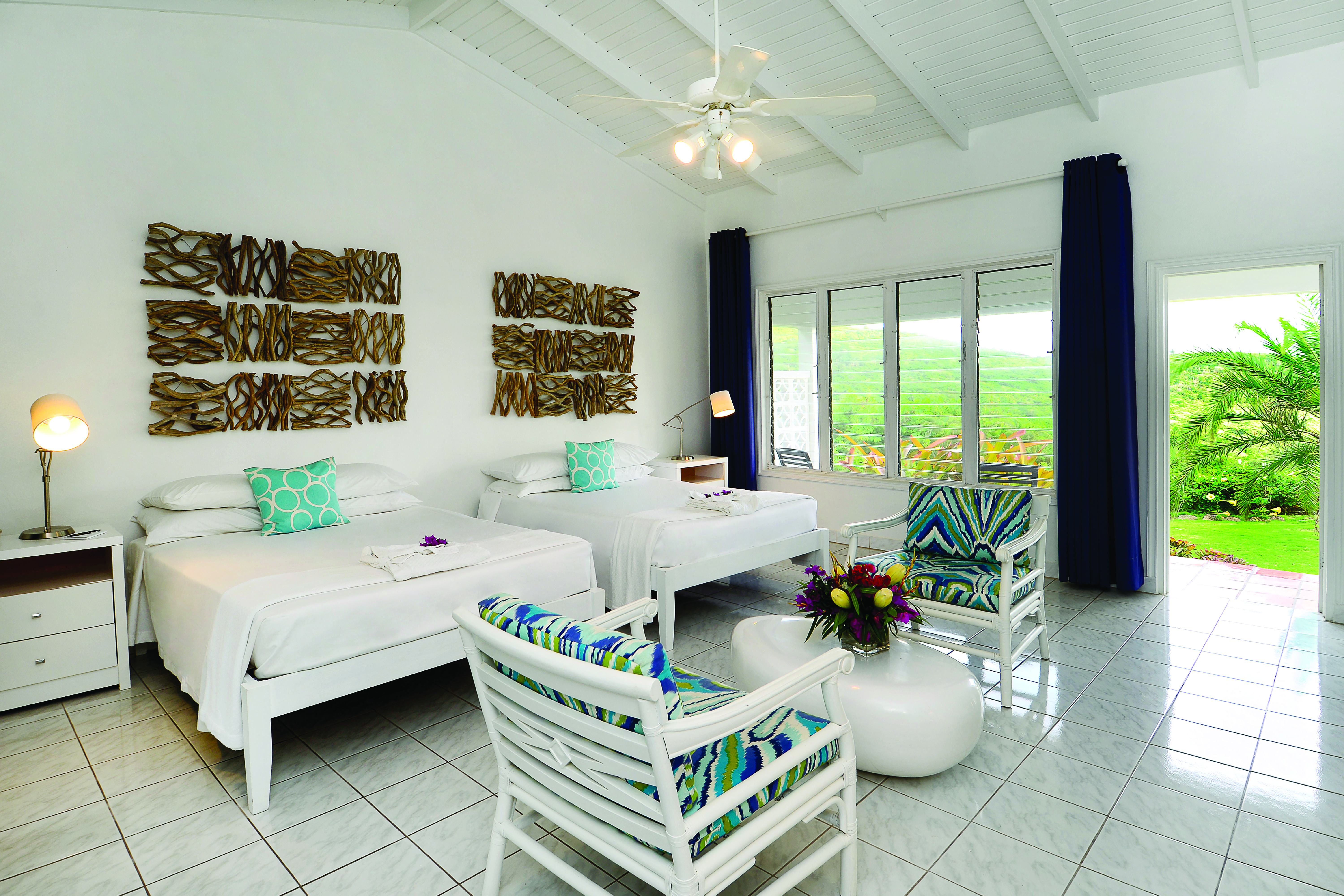 Montpelier Plantation Nevis plantation room twin bedroom with doors leading out to garden