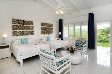 Montpelier Plantation Nevis plantation room twin bedroom with doors leading out to garden
