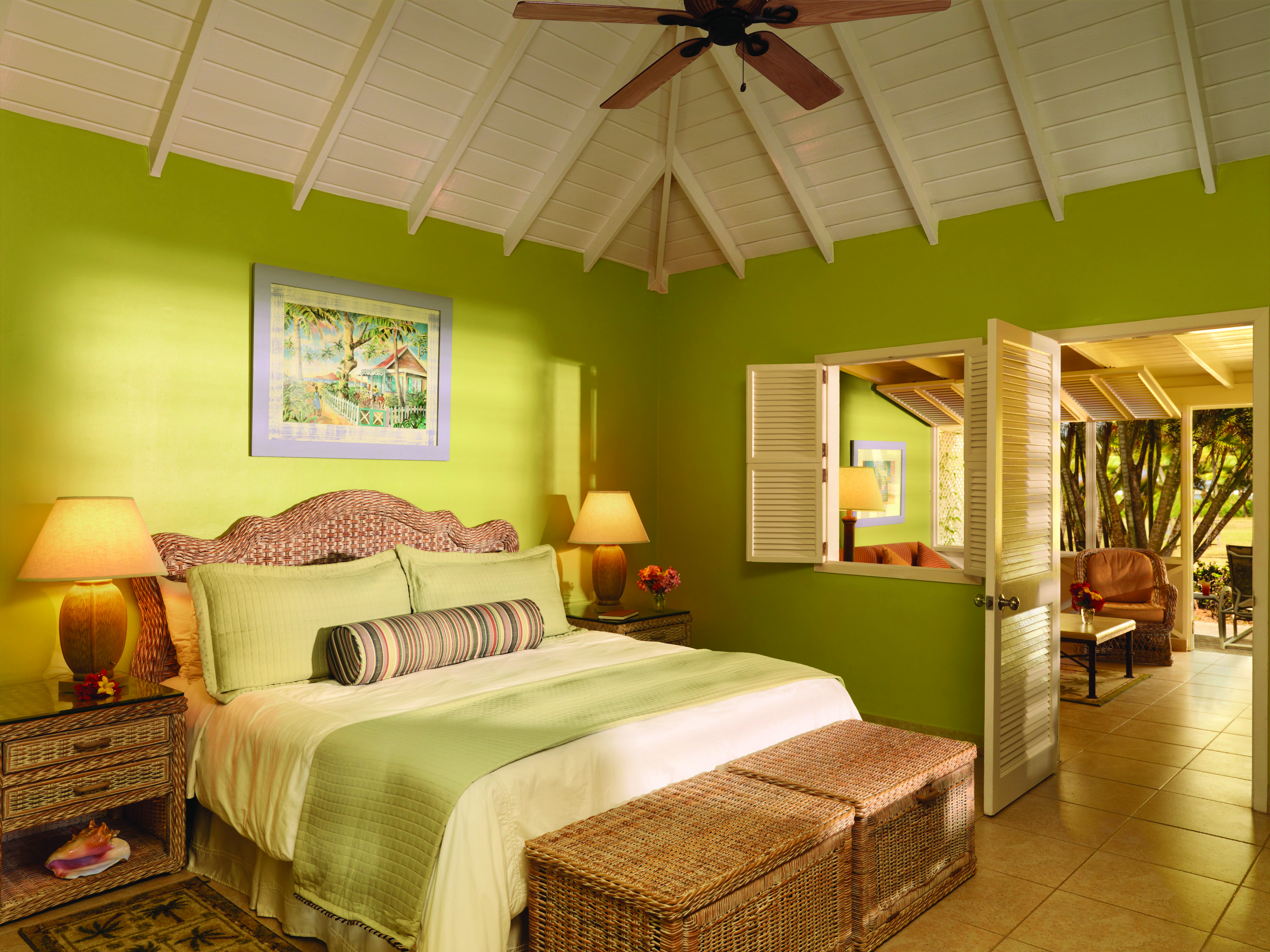 Nisbet Plantation Nevis deluxe garden suite double bed and lounge area