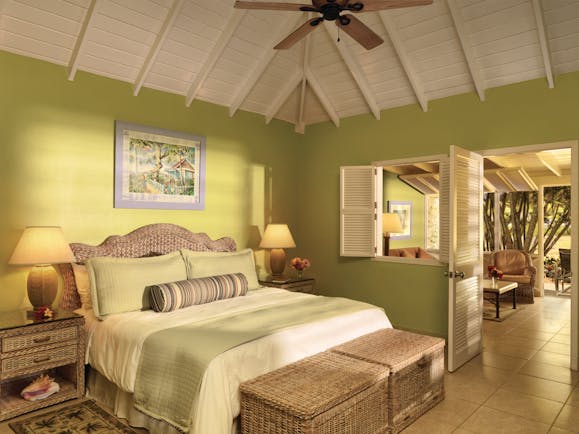 Nisbet Plantation Nevis deluxe garden suite double bed and lounge area