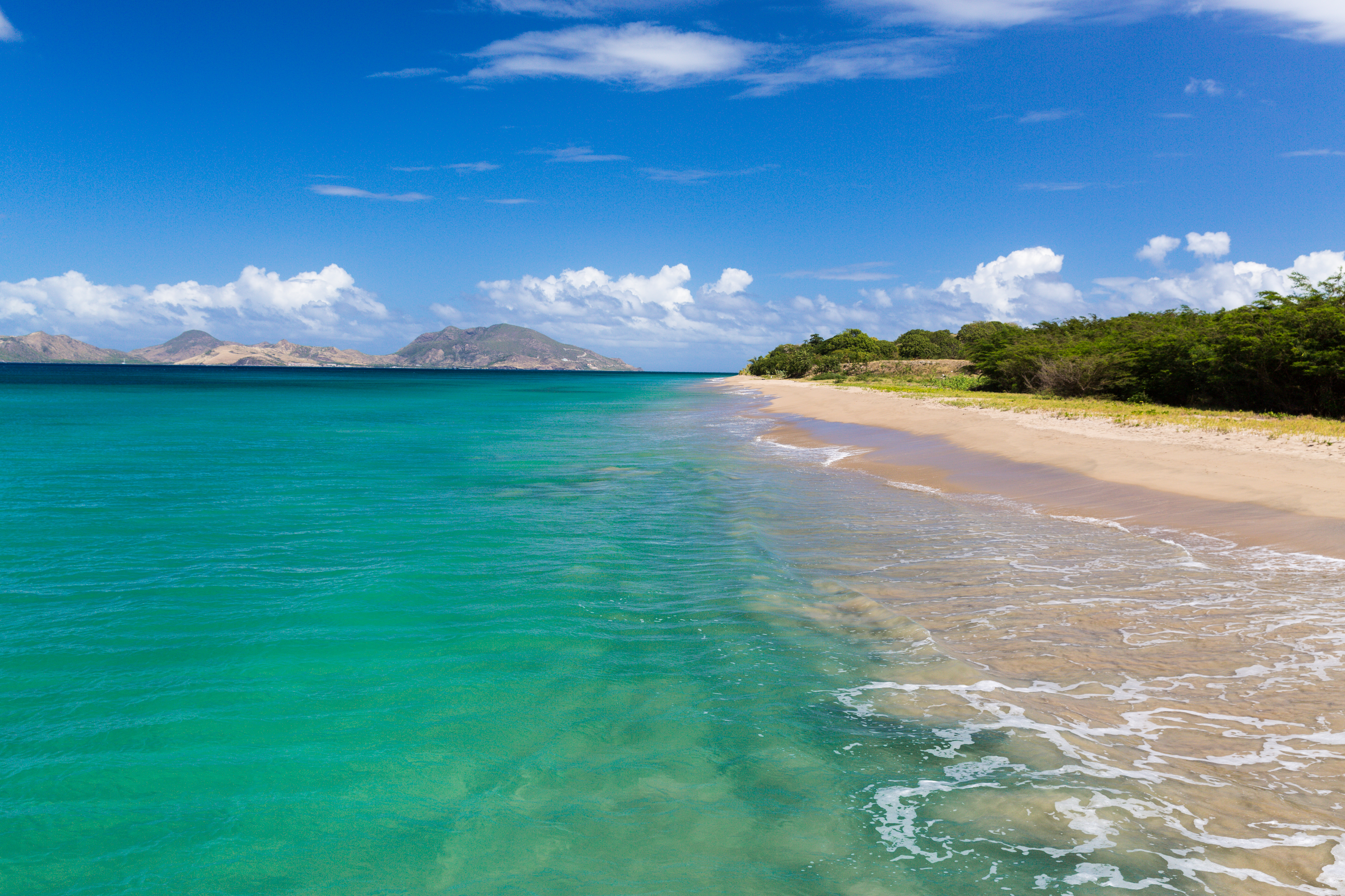 Nevis beach, sand, sea, ST Kitts and the  Narrows in the background