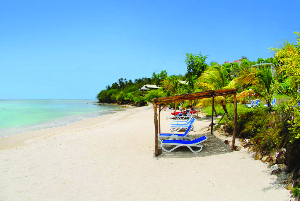 Calabash Cove St Lucia sandy beach clear ocean water sun loungers