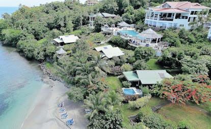 Calabash Cove St Lucia hotel exterior shot of resort beach pool and main building