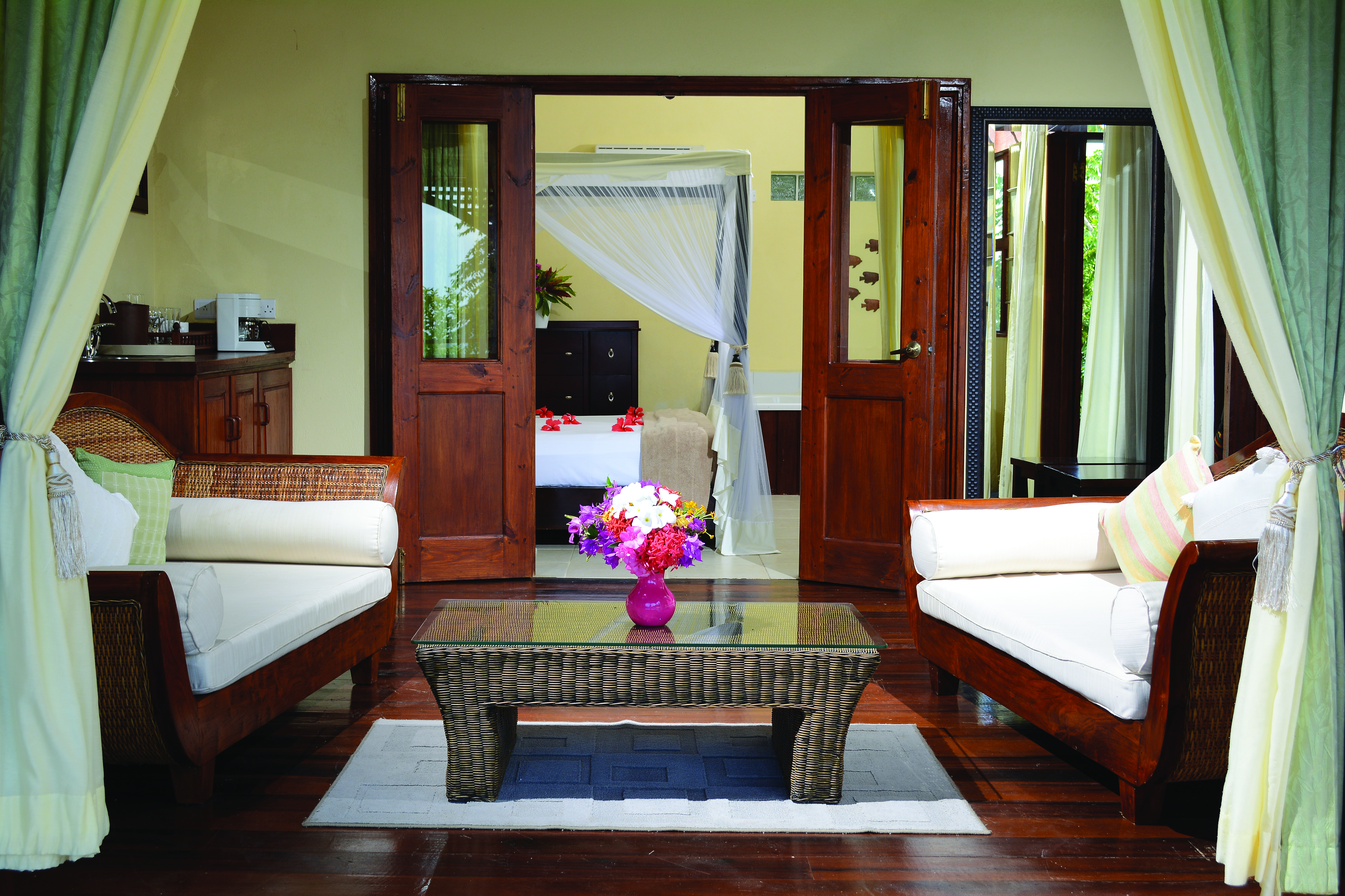 Calabash Cove St Lucia waters edge cottage lounge armchairs coffee table