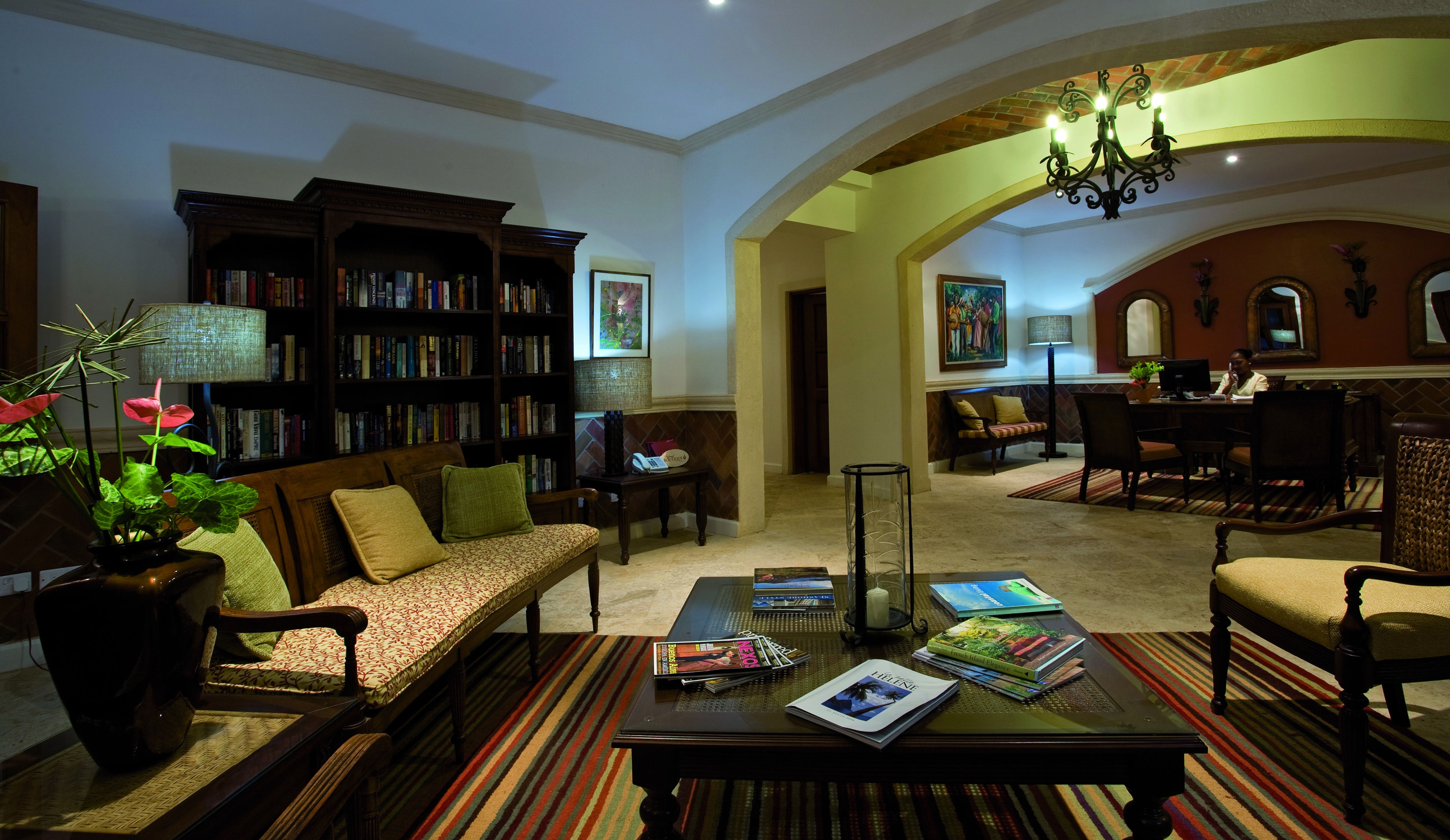 Cap Maison St Lucia reception area seating area coffee table book case