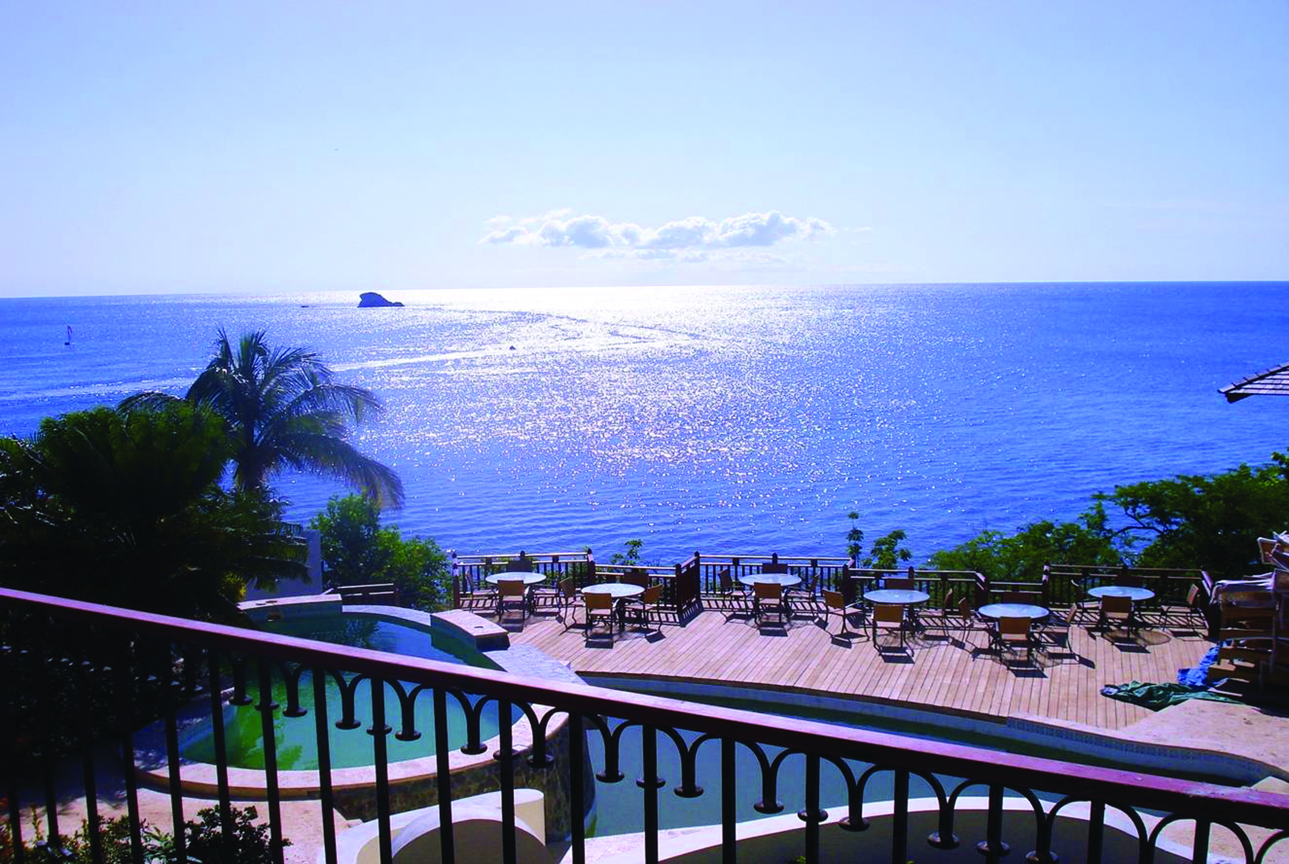 Cap Maison St Lucia view of Caribbean sea from roof top terrace pool and decking 