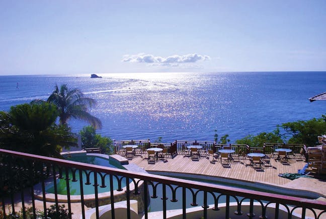 Cap Maison St Lucia view of Caribbean sea from roof top terrace pool and decking 