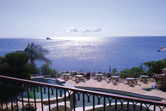 Cap Maison St Lucia view of Caribbean sea from roof top terrace pool and decking 