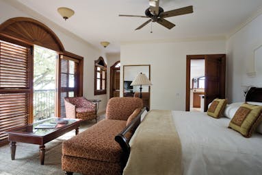 Cap Maison St Lucia villa suite bedroom armchair chaise longue en suite bathroom