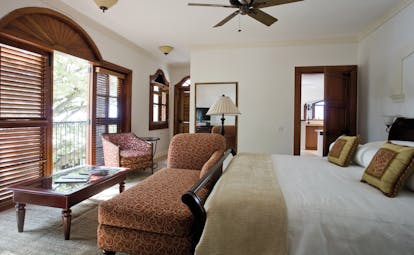 Cap Maison St Lucia villa suite bedroom armchair chaise longue en suite bathroom