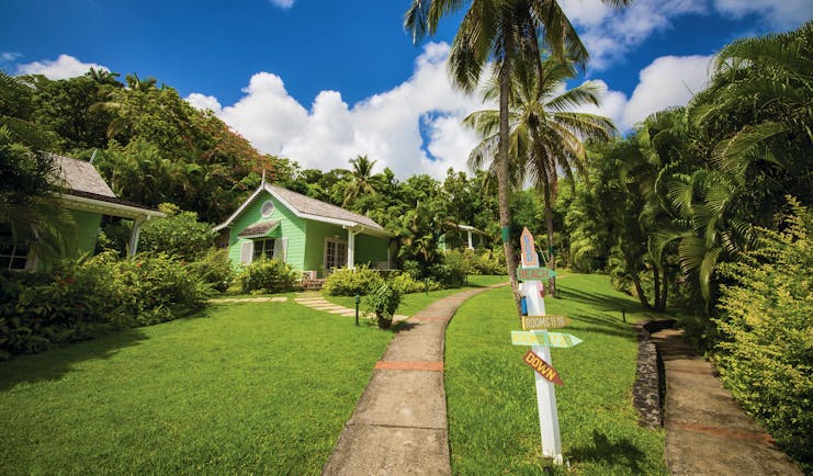 East Winds Inn St Lucia deluxe cottage path across the lawn surrounded by greenery