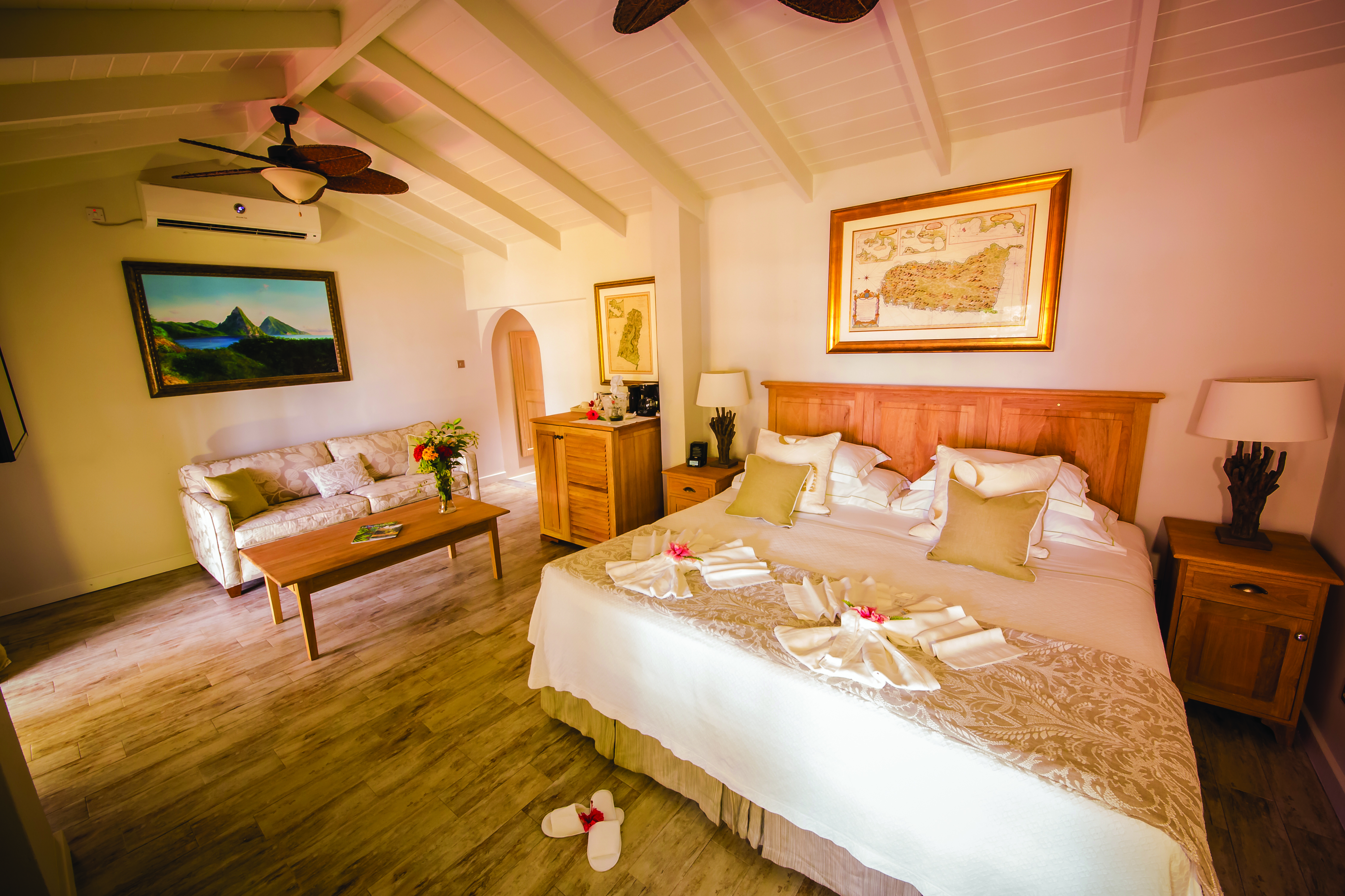 East Winds Inn St Lucia ocean view suite king size bed and lounge area