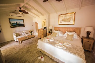 East Winds Inn St Lucia ocean view suite king size bed and lounge area