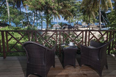 East Winds Inn St Lucia ocean view terrace outside seating area with views of beach and ocean