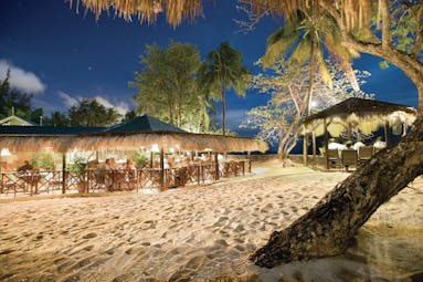 East Winds Inn St Lucia restaurant dining on the beach by night
