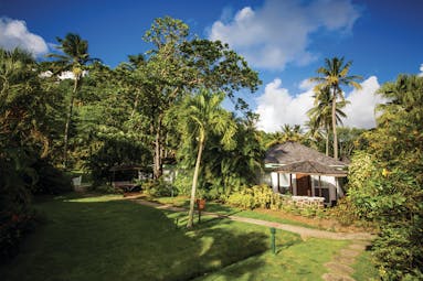 East Winds Inn St Lucia superior cottage exterior surrounded by greenery