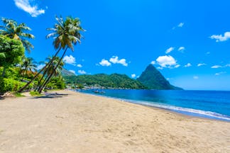 Paradise Beach in Saint Lucia, sand, sea, palm trees, Piton in background