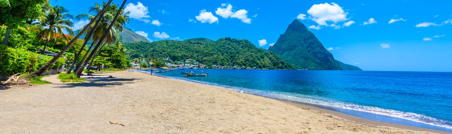 Paradise Beach in Saint Lucia, sand, sea, palm trees, Piton in background