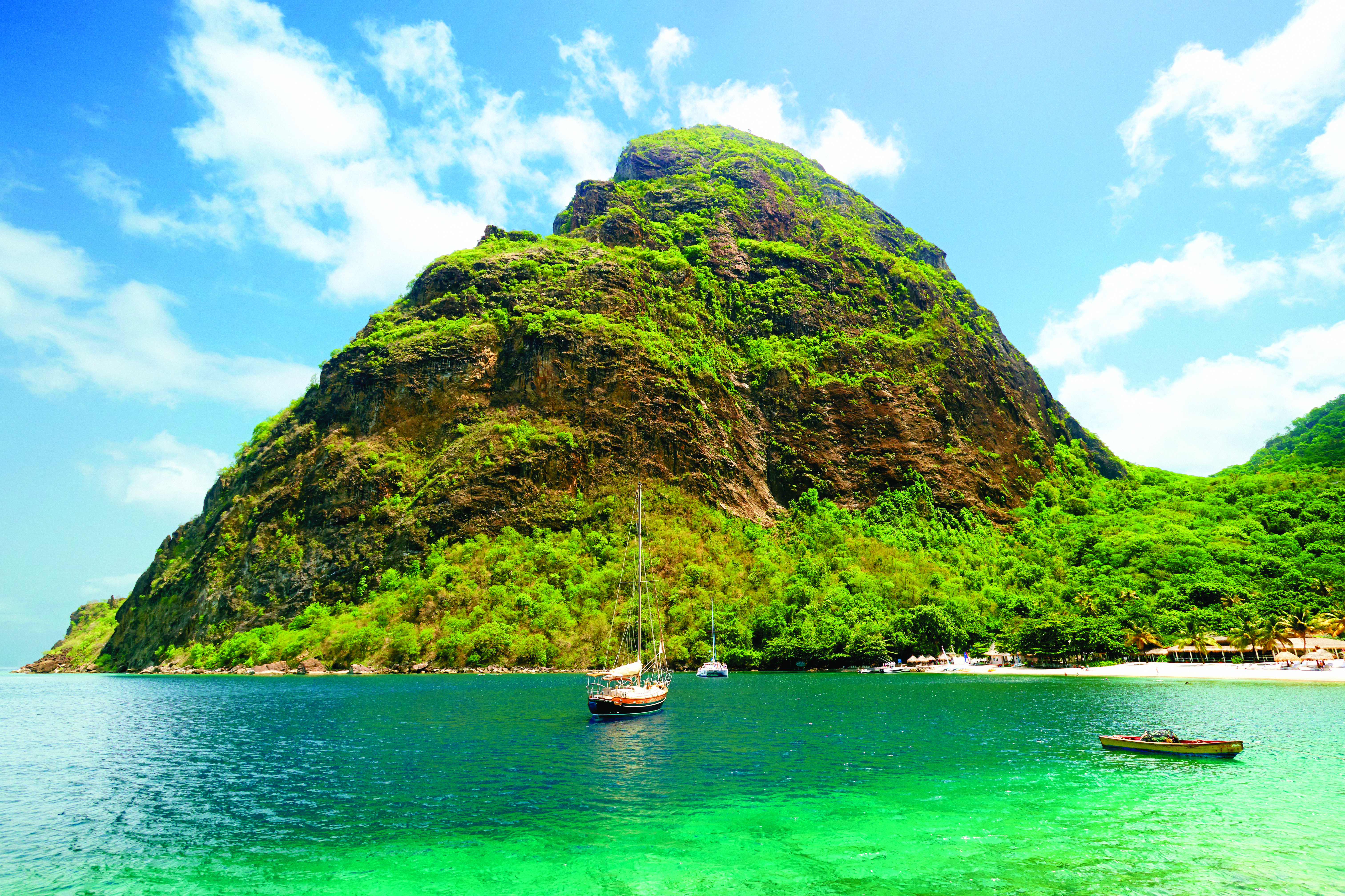 Sugarbeach St Lucia view of resort from the sea boats on the water