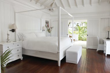 Sugarbeach St Lucia villa bedroom four poster bed doors opening to terrace