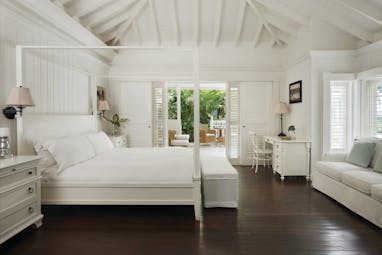 Sugarbeach St Lucia villa interior bed and bedroom furniture sofa and outdoor seating area
