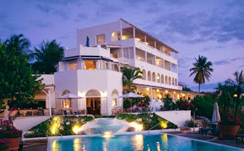 La Samanna St Martin hotel exterior pool white building balconies gardens