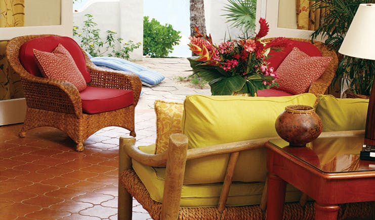 La Samanna St Martin terrace wicker armchairs floral arrangements