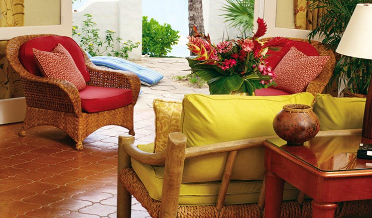 La Samanna St Martin terrace wicker armchairs floral arrangements