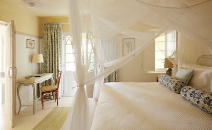 Cotton House St Vincent and the Grenadines bedroom canopied bed dressing table