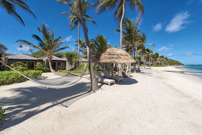 Petit St Vincent beach hammock palm trees