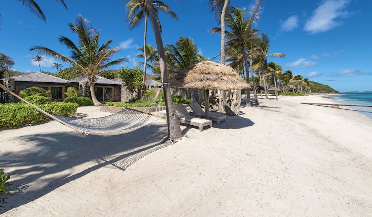 Petit St Vincent beach hammock palm trees