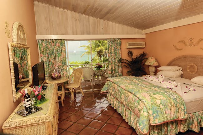 Coco Reef Tobago bedroom rattan bedroom furniture doors leading to balcony