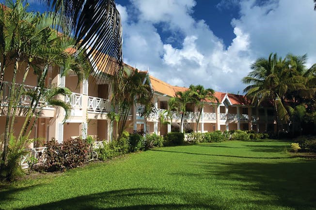 Coco Reef Tobago hotel exterior lawn trees building