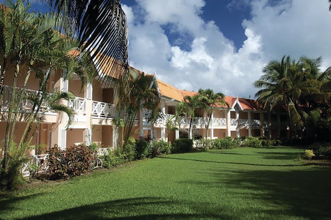 Coco Reef Tobago hotel exterior lawn trees building