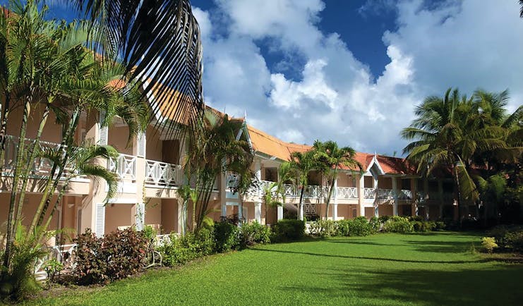 Coco Reef Tobago hotel exterior lawn trees building